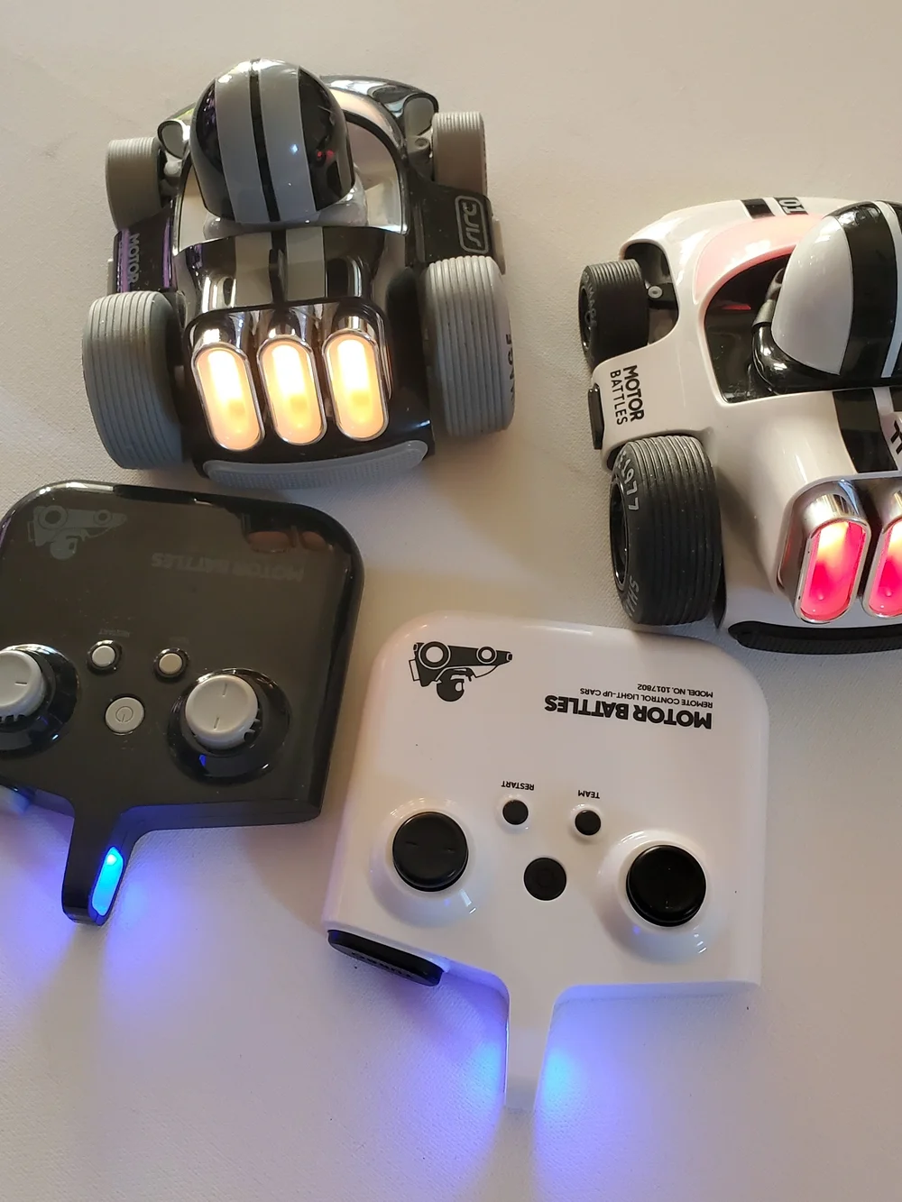 Sharper Image Glow RC Battle Cars — Black & White with Red & Blue LEDs